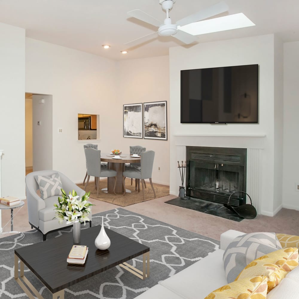 Model living room with a fireplace at Tory Estates Apartment Homes in Clementon, New Jersey