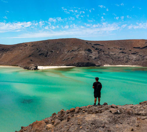 Man standing overlooking the lake
