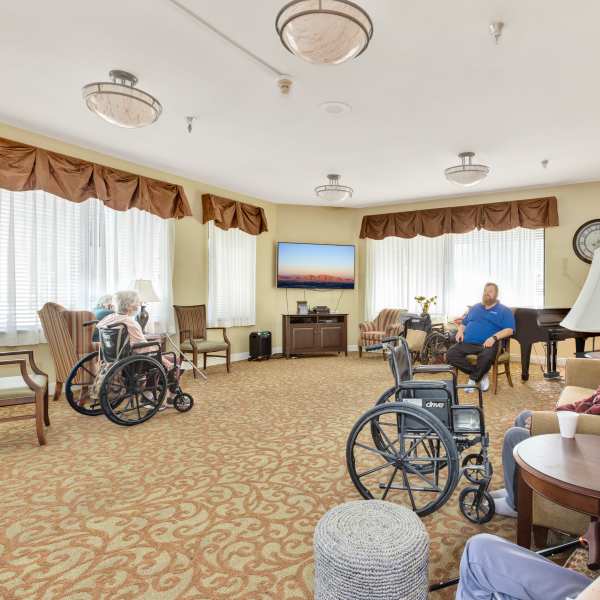 Resident interacting with a caregiver at Savant of Tarzana in Tarzana, California