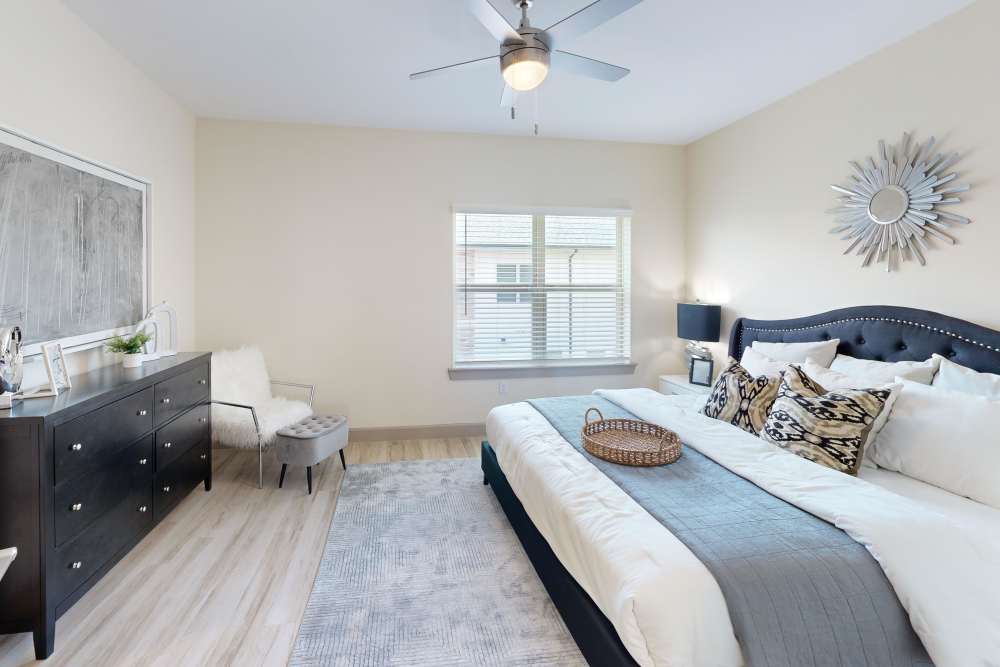 Main bedroom in Townhome at Malloy Bridge Apartments in Seagoville, TX