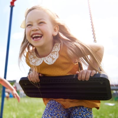 A child playing on a playground at Coral Sea Cove in Port Hueneme, California