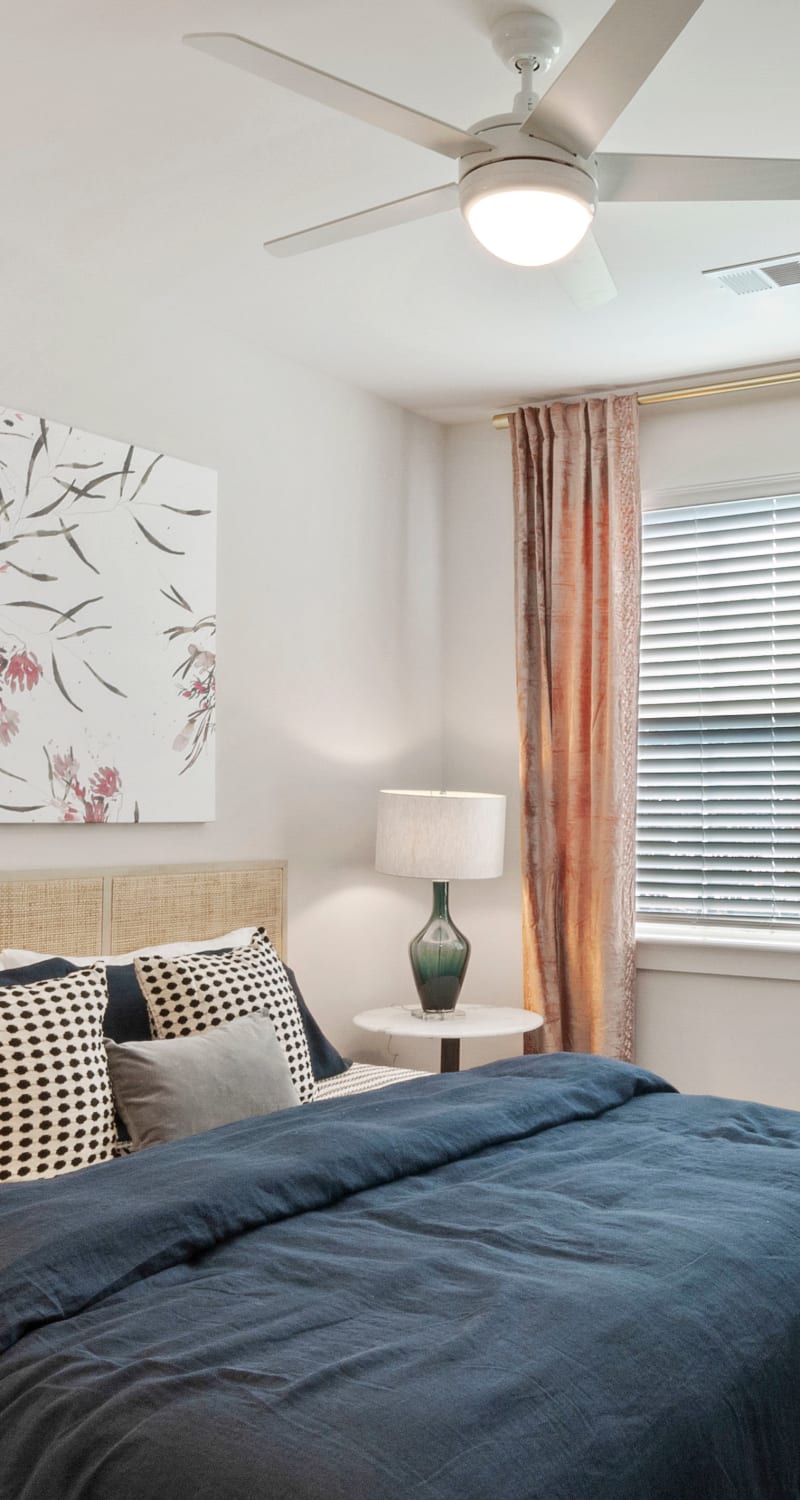 Modern bedroom with a ceiling fan at Artisan Carolina Forest in Myrtle Beach, South Carolina