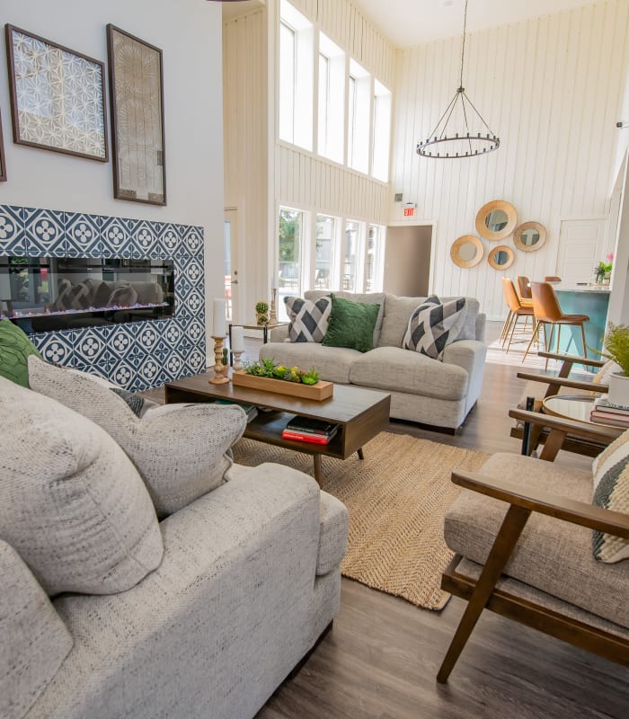 Lounge area with fireplace at Aspen Park Apartments in Wichita, Kansas