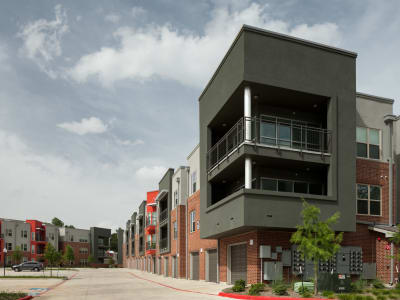 Exterior of apartments with big balcony at Anatole at the Pines in Conroe, Texas