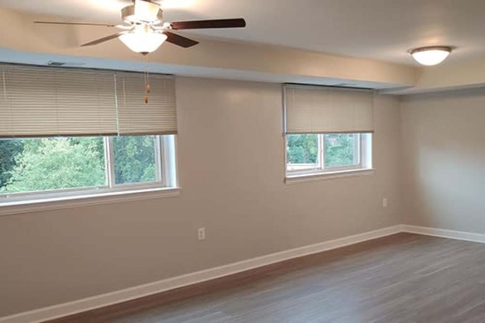 Spacious living room with ceiling fan and light at 515 Thayer in Silver Spring, Maryland