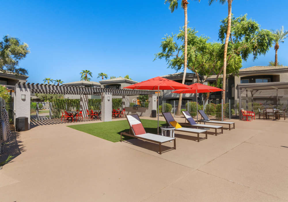 Modern bedroom with side lamp at Luxe @ Ocotillo in Chandler, Arizona  
