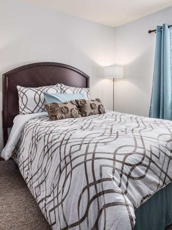 A freshly made bed at Parkside of Livonia in Livonia, Michigan