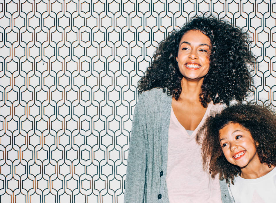 Resident mother and daughter posing for a cool photo in front of a neat background at Sofi Lyndhurst in Lyndhurst, New Jersey