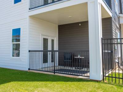 exterior of building shows a corner unit floor plan's beautiful and spacious balcony