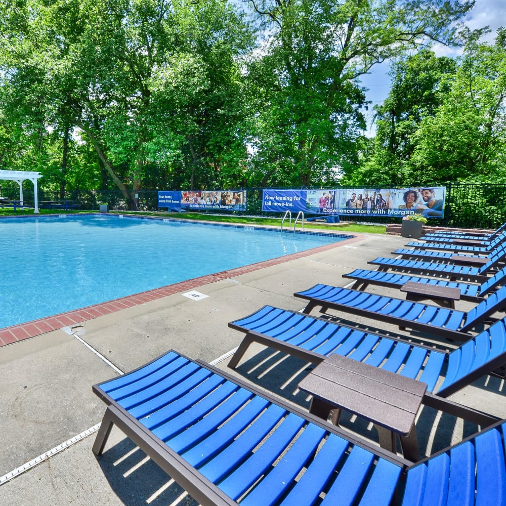 Outdoor furniture and swimming pool at The Villas at Bryn Mawr Apartment Homes in Bryn Mawr, Pennsylvania