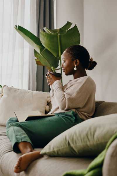 Resident on her sofa at City Limits Apartments in Columbia, Tennessee