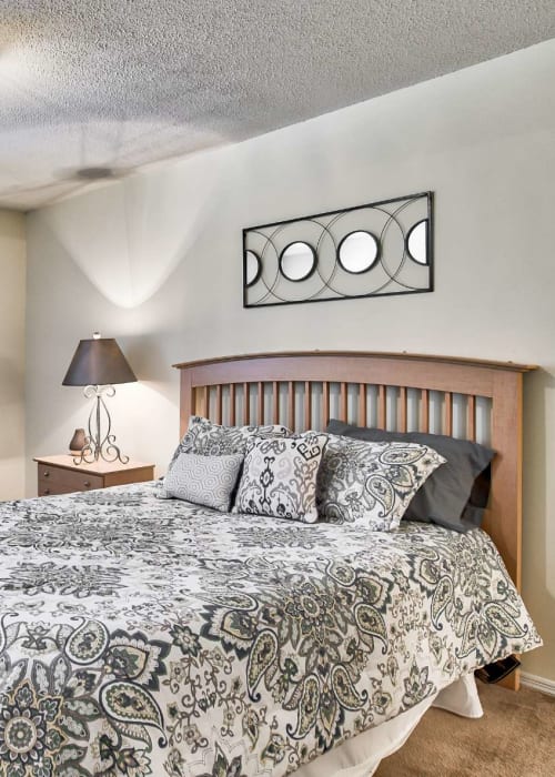 Resident bedroom with plush carpeting at The Pointe in Athens, Georgia