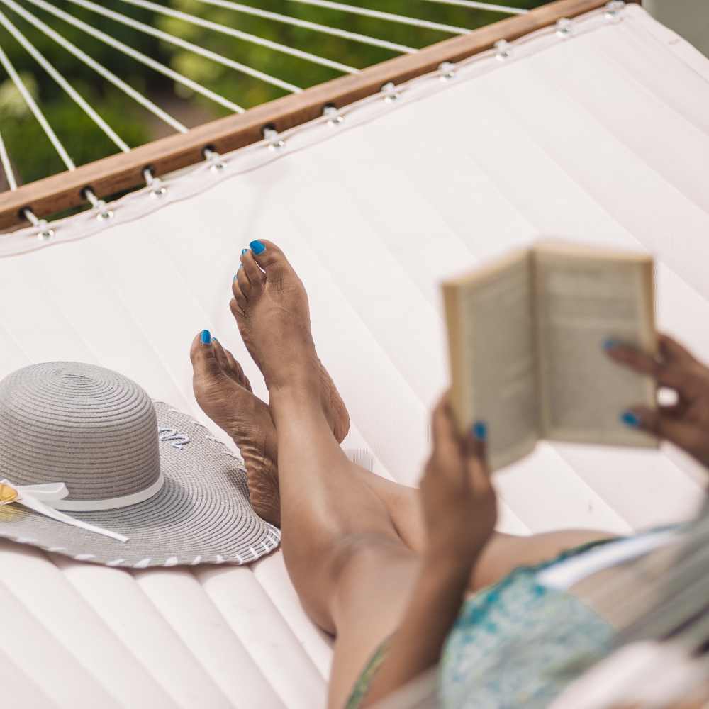 Resident reading a book in a hammock at Springfield Apartments in Murfreesboro, Tennessee