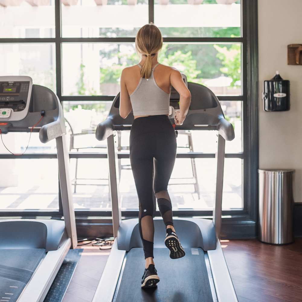 Resident jogging on a treadmill in the fitness center at Springfield Apartments in Murfreesboro, Tennessee