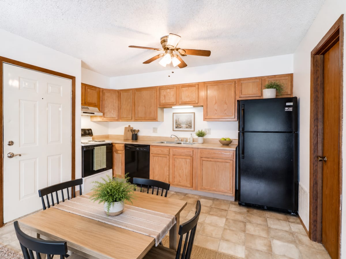 Cozy kitchen with black appliances at South View in Ames, Iowa