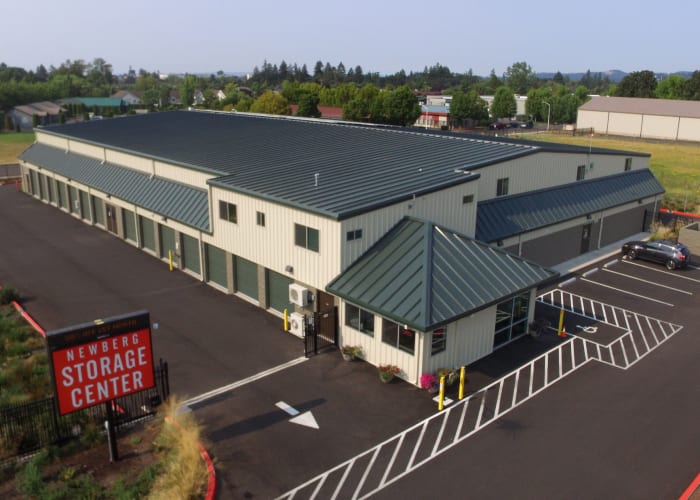 Exterior of the leasing office and electronic gated entrance at Newberg Storage Center in Newberg, Oregon