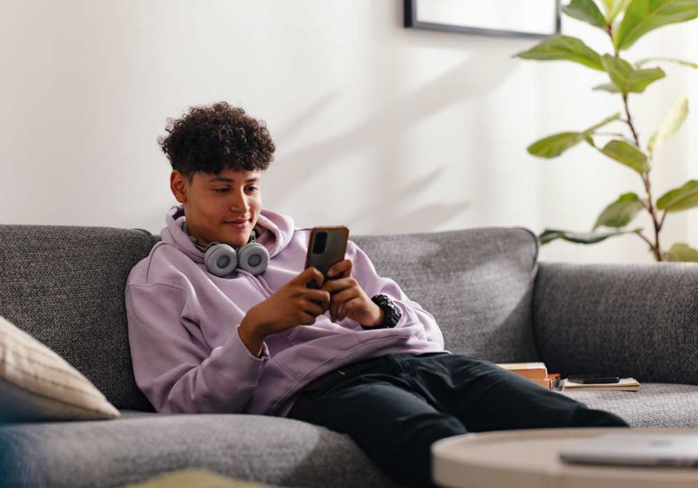 Guy checking his mobile at Walnut Apartments in Philadelphia, Pennsylvania