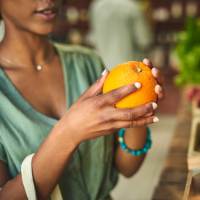 Resident buying fresh fruits in the market near Seacrest in Katy, Texas