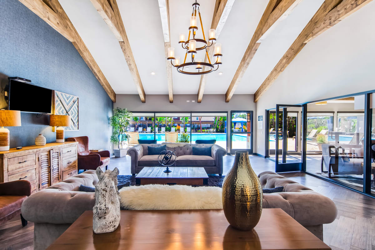 Modern, spacious clubhouse with ample seating at West Fifth Apartments in Ontario, California