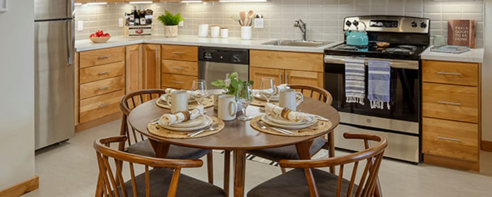 Well lit dining room in senior living apartment at The Springs at Sherwood in Sherwood, Oregon