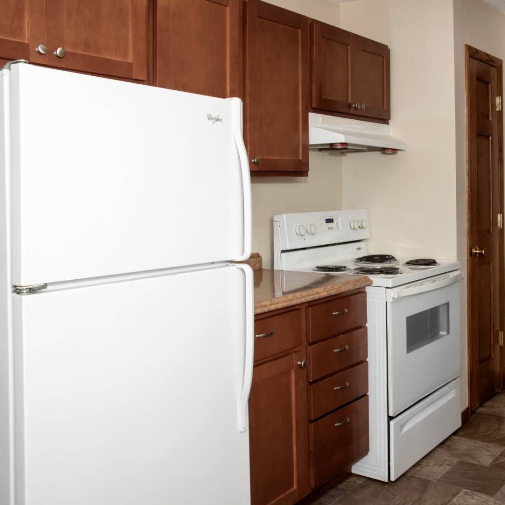 Kitchen with white appliances at Bass Lake Crossing in New Hope, Minnesota