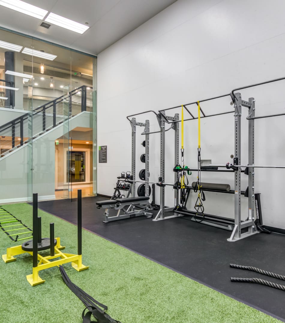 Weight racks and a sled in the fitness center at Sofi Parc Grove in Stamford, Connecticut
