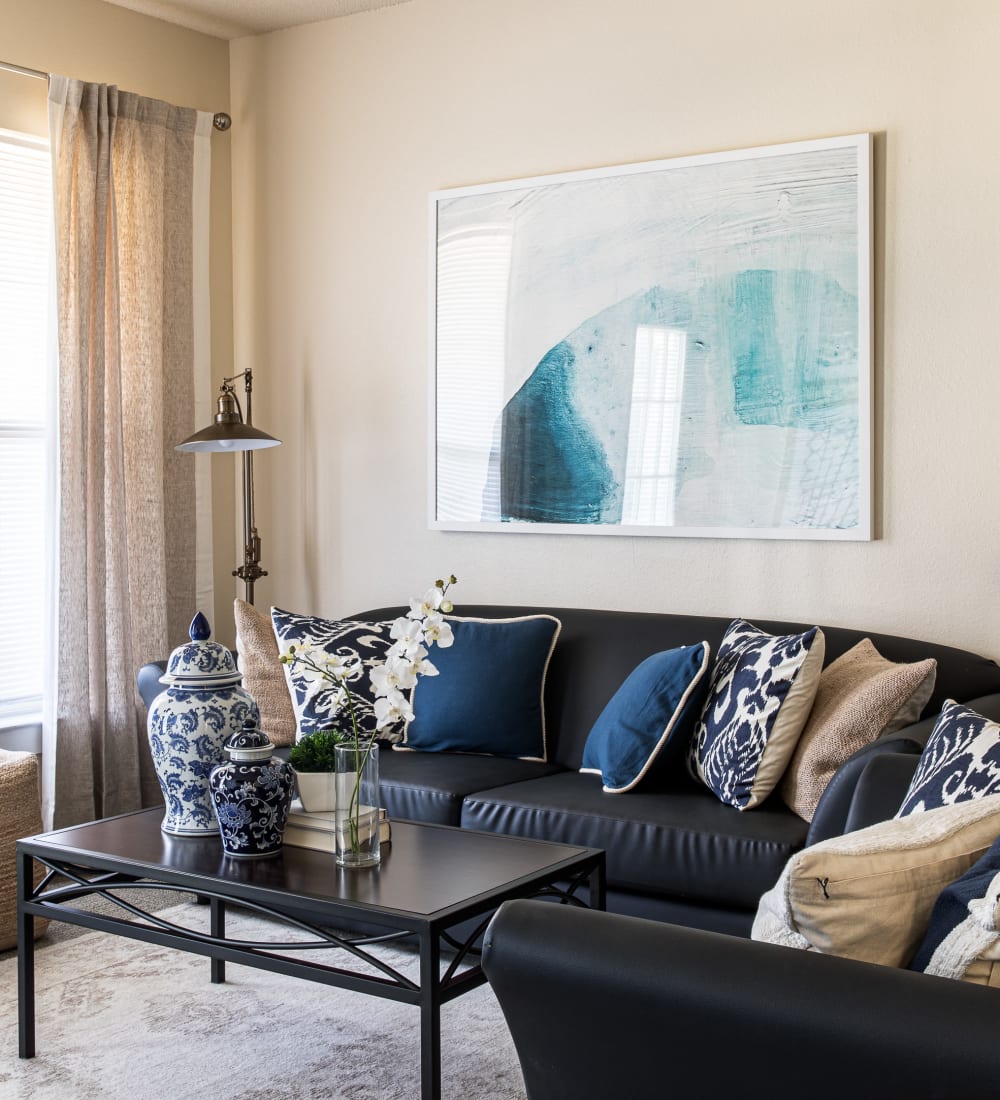 Model living room with great natural light in a student apartment at River Pointe in Carrollton, Georgia
