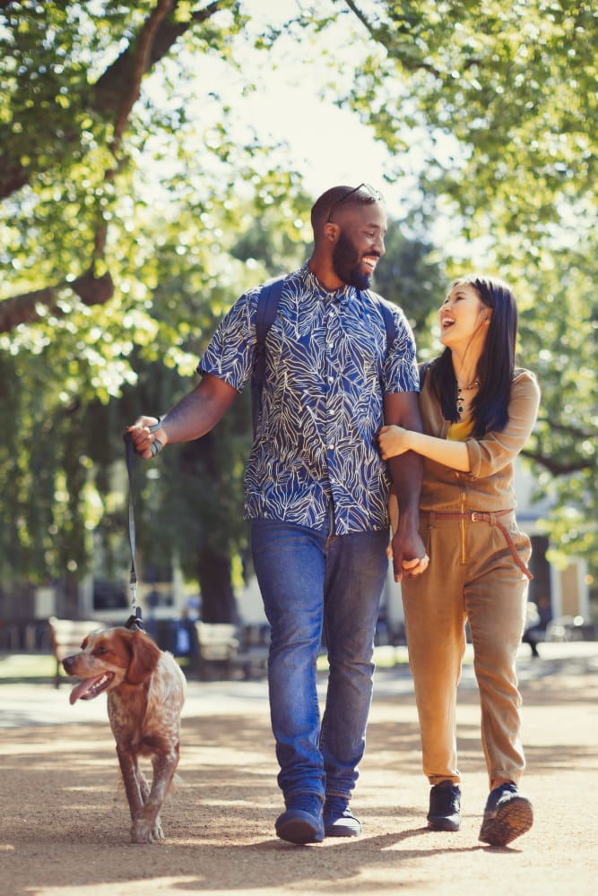 Residents walking their dog at Ingleside Apartments in North Charleston, South Carolina