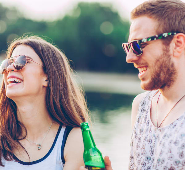 Young couple enjoying the outdoors near Oakmont Park Apartments in Scranton, Pennsylvania