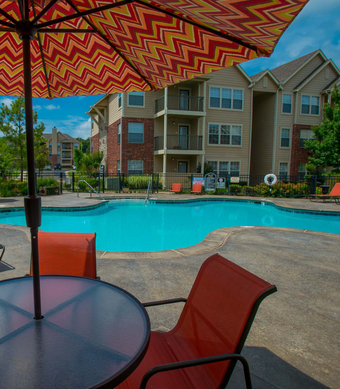 Pool with patio seating at Nickel Creek Apartments in Tulsa, Oklahoma