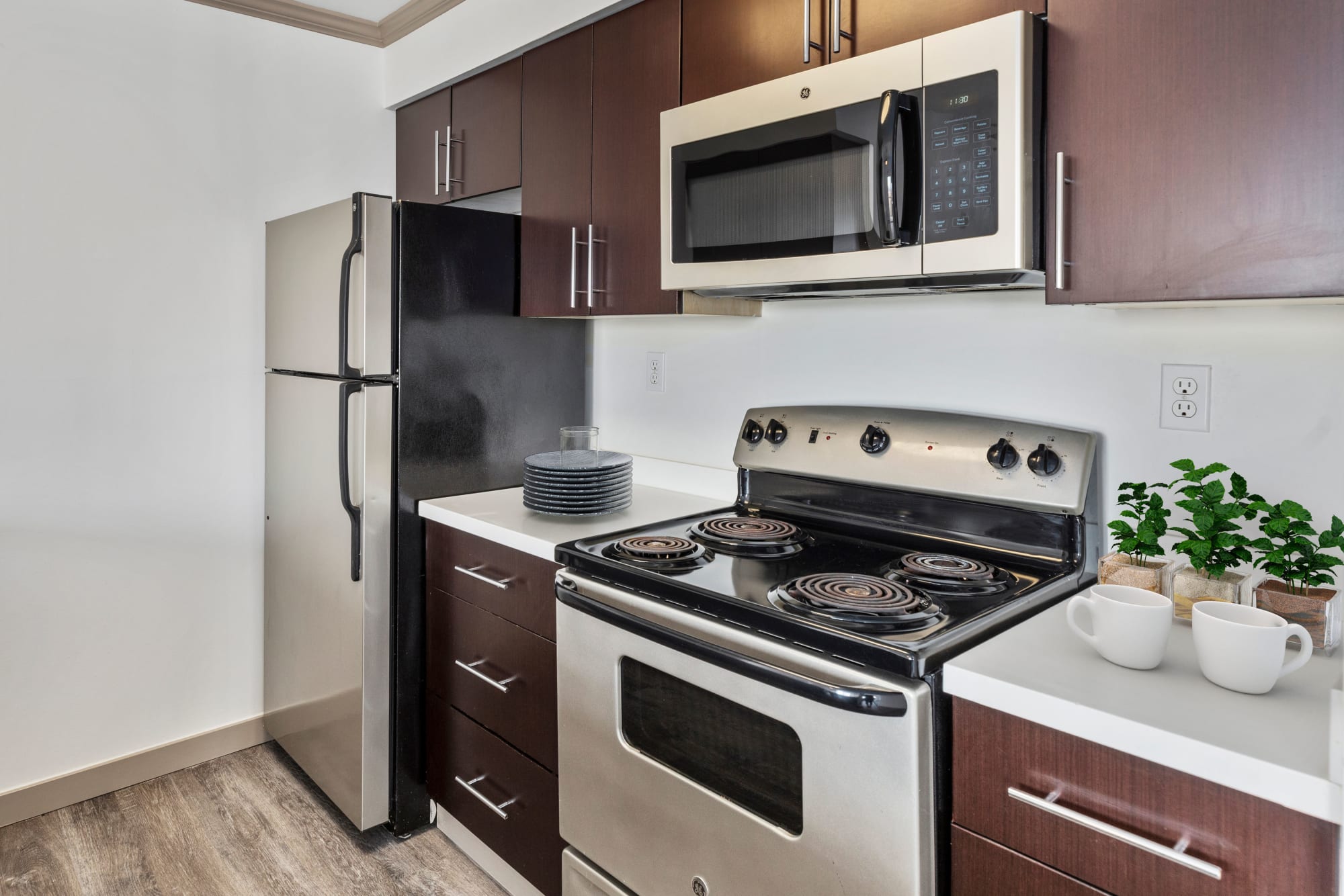 A kitchen with modern stainless appliances at Elan 41 Apartments in Seattle, Washington