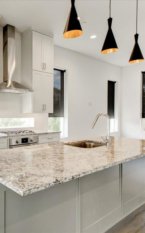 Large kitchen with granite countertops at The Collection Townhomes in Dallas, Texas