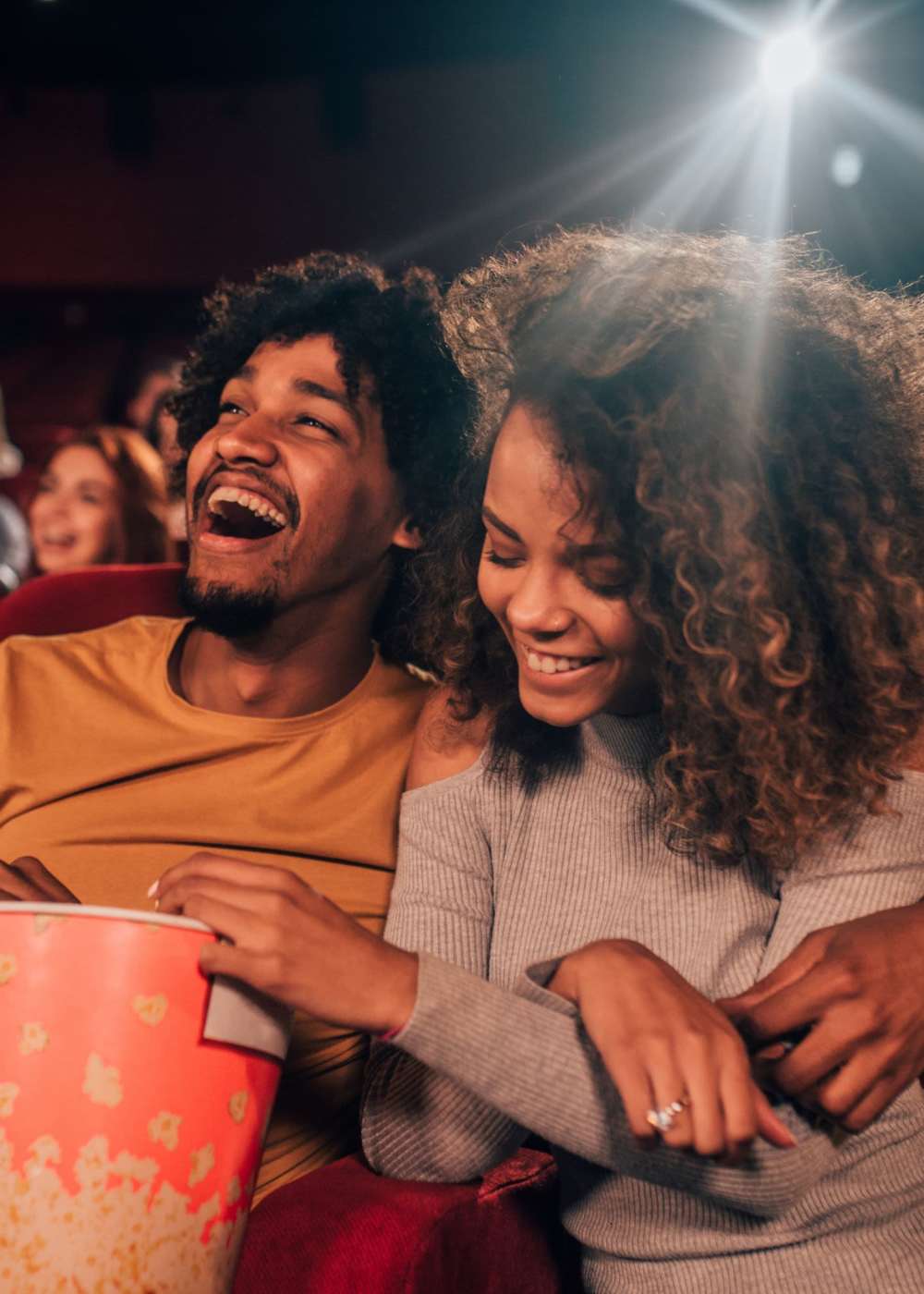 Residents bonding in a movie theatre near M2 Apartments in Denver, Colorado