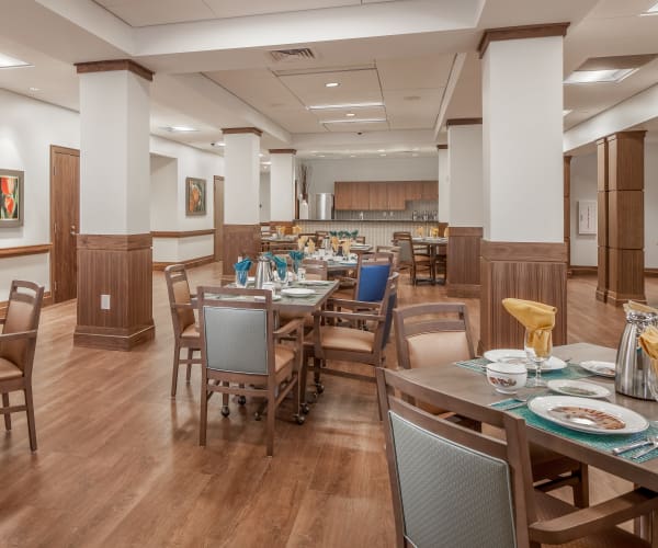 Bright dining area for residents at All Seasons Naples in Naples, Florida