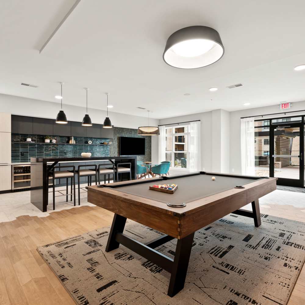 Clubhouse with pool table and community kitchen at Neo Vantage Point in Maryland Heights, Missouri