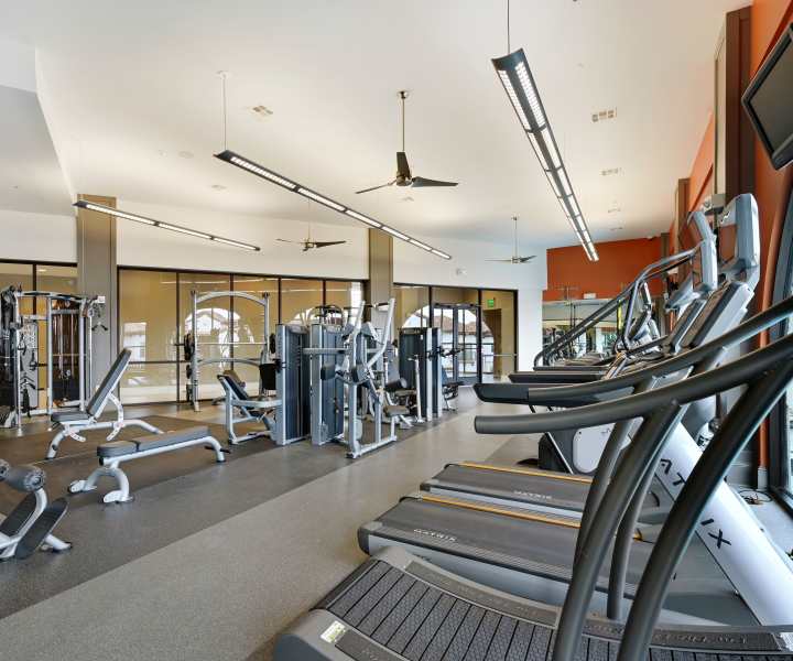 Fully-equipped fitness center with television at Domain Memorial in Houston, Texas 
