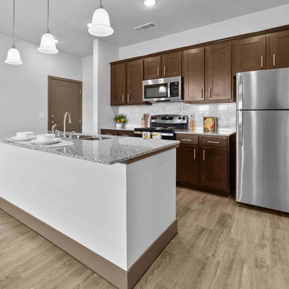 Kitchen with appliances at Harvest Creek in Marshall, Texas