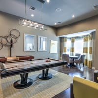 Enjoy a game of pool inside resident clubhouse at Waterstone at Cinco Ranch in Katy, Texas