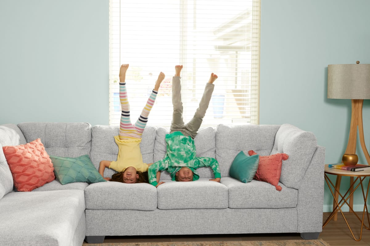 Kids playing on a couch at BB Living at Civic Square in Goodyear, Arizona