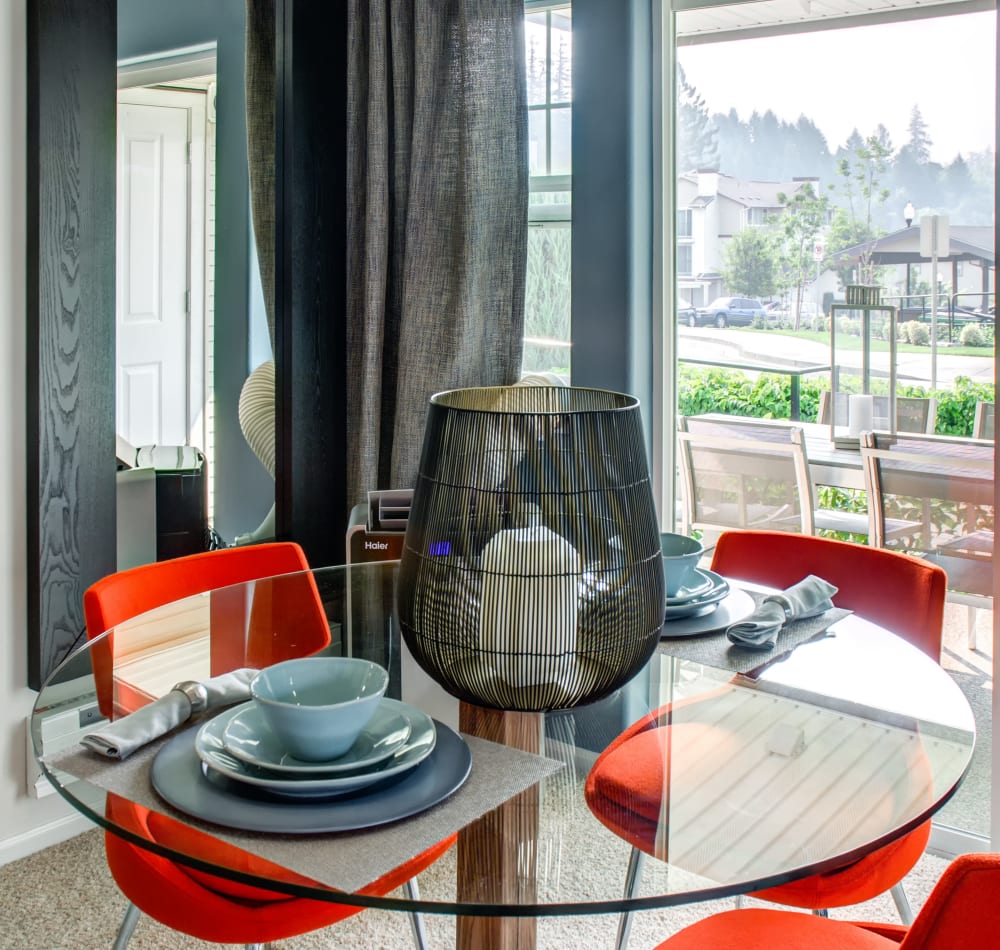 Dining area in a model home looking out into the beautifully maintained community at Sofi at Cedar Mill in Portland, Oregon