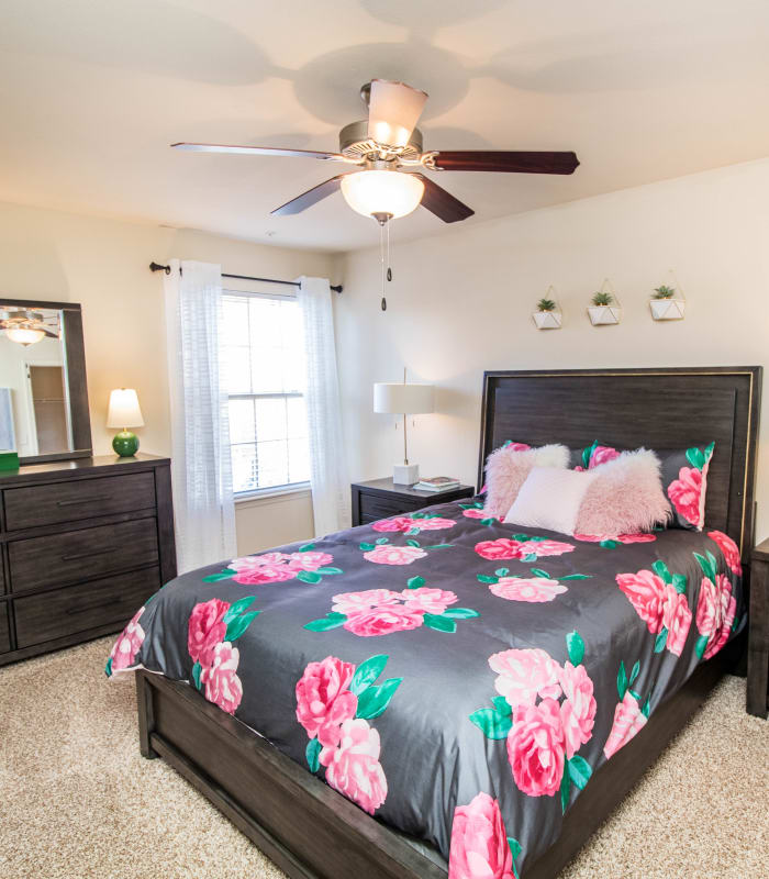 Chic bedroom with ceiling fan at Tuscany Place in Lubbock, Texas