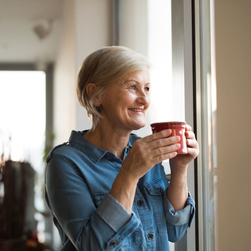 A resident sips coffee in her apartment at Acclaim at Cary Pointe, Cary, North Carolina