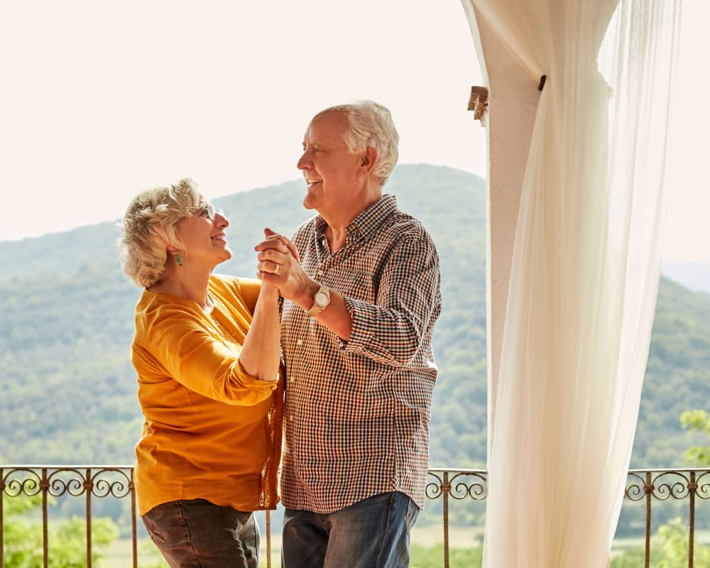 Couple dancing on the balcony at Pasadena Highlands in Pasadena, California