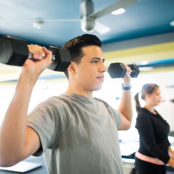 Residents getting in shape at the onsite fitness center at San Valencia in Chandler, Arizona