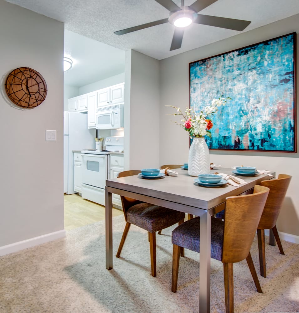 Dining area next to the modern kitchen in a model home at Waterstone Fremont in Fremont, California