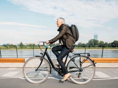 Resident riding his bike near Hudson Oaks Active Adult Living in Bryan, Texas