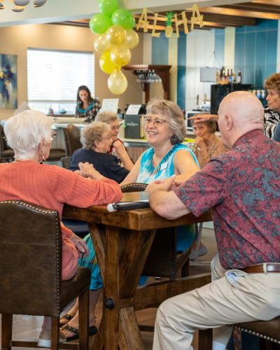 Group of residents at a luau event at The Views at Lake Havasu in Lake Havasu City, Arizona