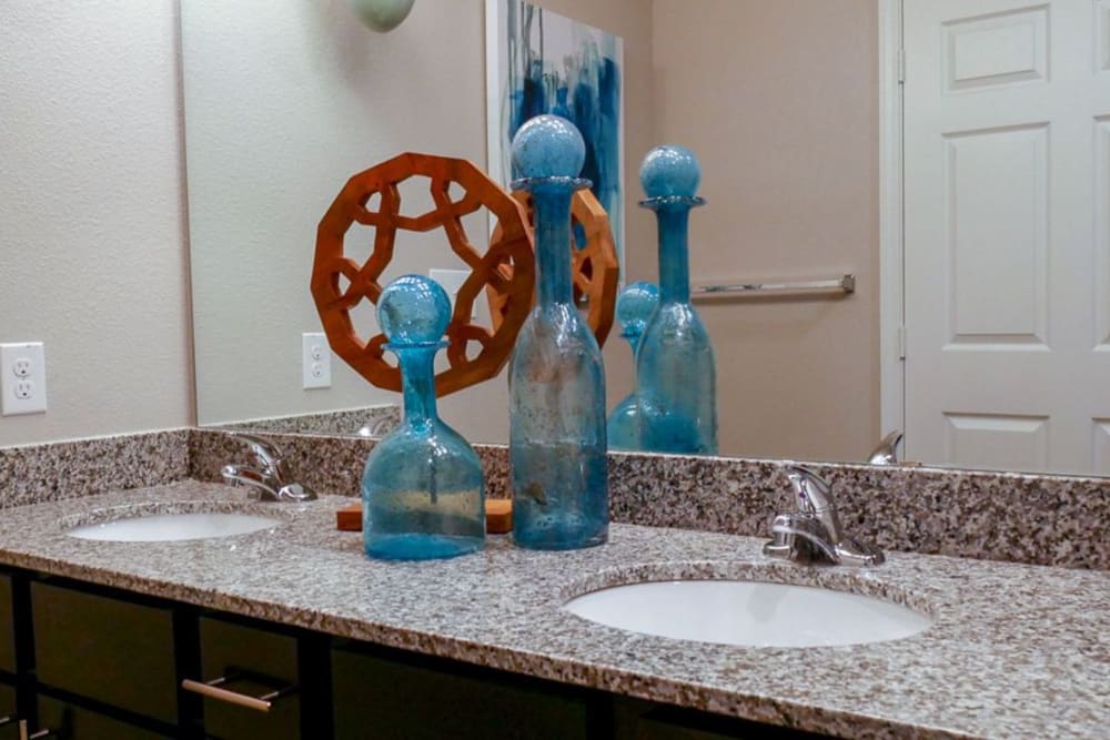 His and her sinks in a model bathroom at Biltmore at the Park in Pflugerville, Texas