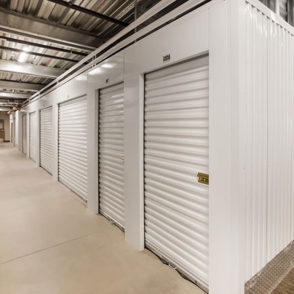 Indoor storage units with white doors at StorQuest Self Storage in Castle Rock, Colorado