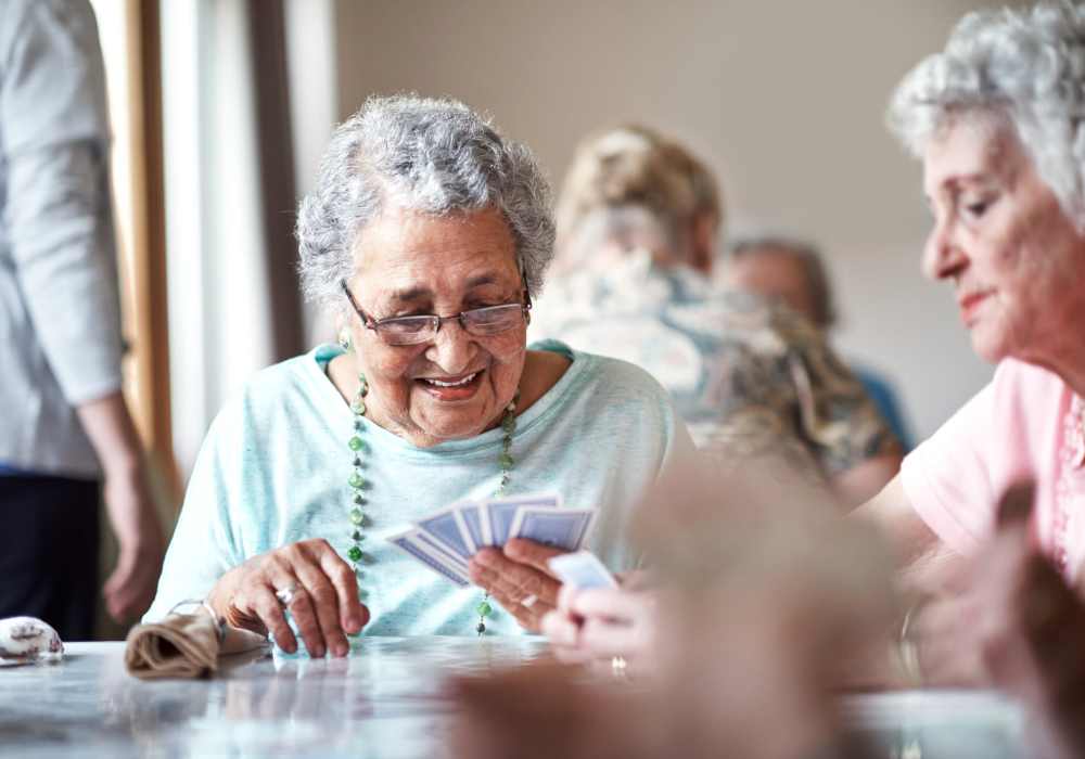 Caretaker helping resident at Clearwater at Riverpark in Oxnard, California